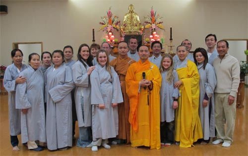 Members of the Dinh Quang Community posing for a photo.